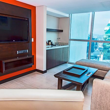 Megapolis Hotel Panama Luaran gambar A living room at the hotel